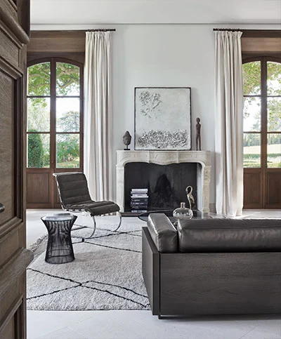 Armless-Chair-and-Platner-Side-Table_l.webp