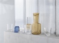 Raise-carafe-burnt-orange-glass-dark-blue-burnt-orange-clear-muuto-org.jpg